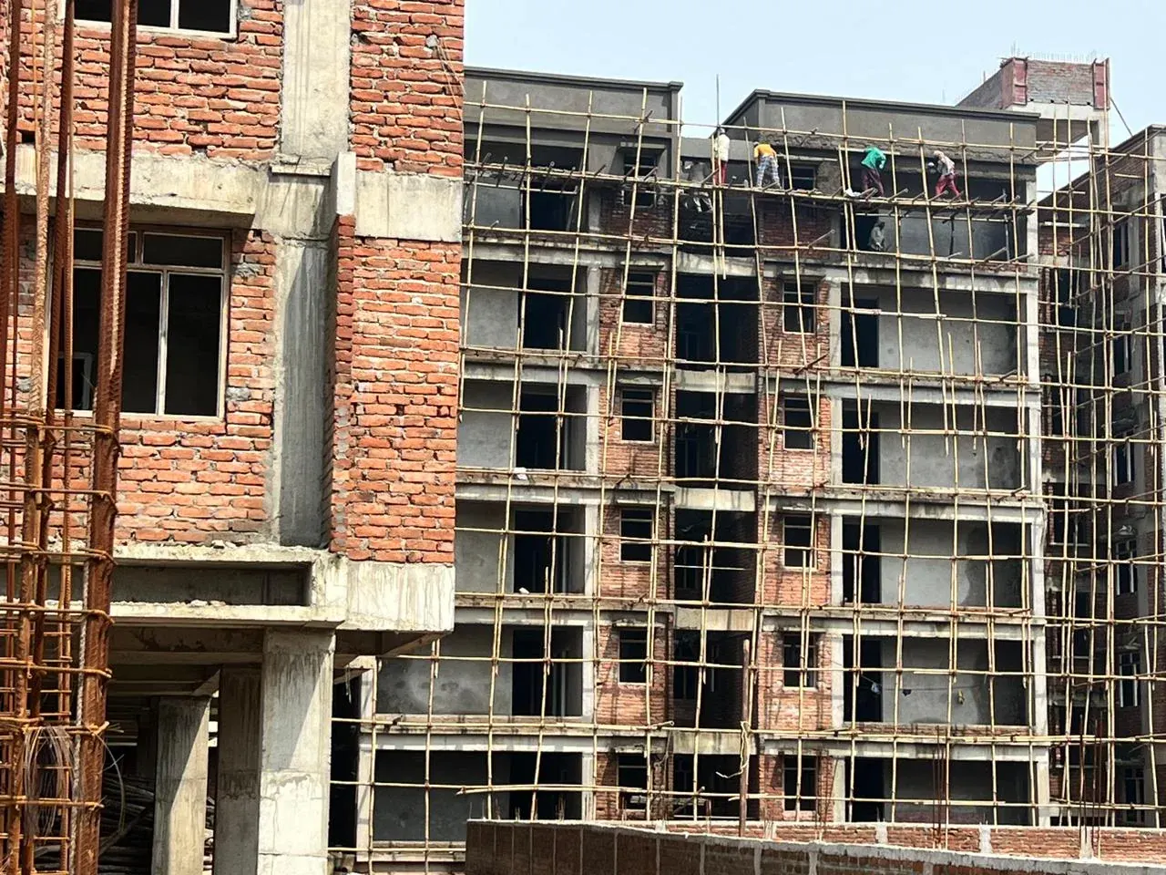Bamboo scaffolding on brick building